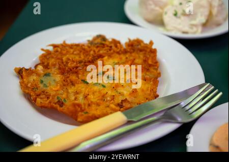 Traditional Andalusian dish from deep roasted potato and seafood, Tortillitas de Camarones, Shrimp Fritters served in old tavern as tapas, Sanlucar de Stock Photo