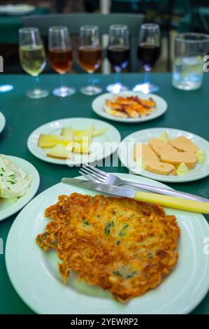 Traditional Andalusian dish from deep roasted potato and seafood, Tortillitas de Camarones, Shrimp Fritters served with sherry wines in old tavern as Stock Photo