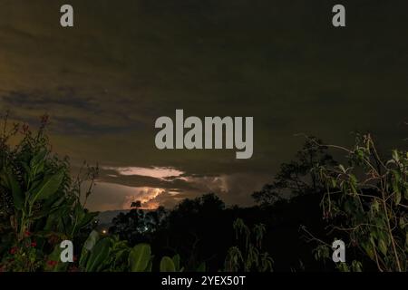Long exposure of a nocturnal electric storm over the western Andean mountains of central Colombia, captured from a farm in the eastern mountains. Stock Photo
