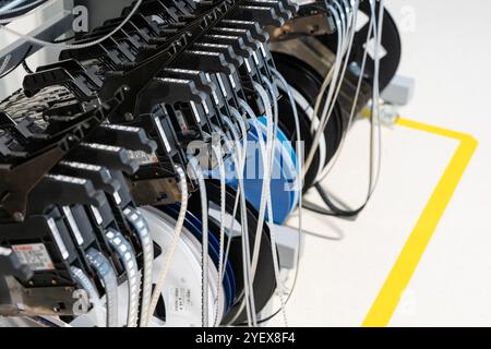 Electronics SMT reel components and feeders on the assembly line Stock Photo