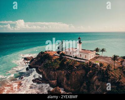 Aerial view of the lighthouse perched on a rocky cliff overlooking the ...