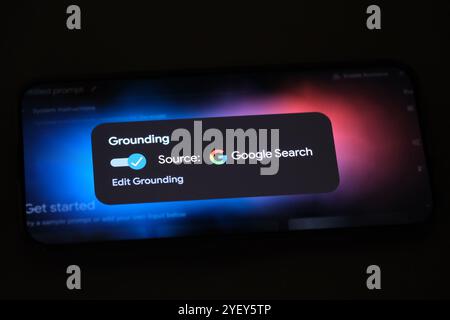 Grounding with Google Search on phone screen Stock Photo