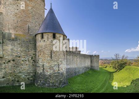 Cite de Carcassonne is a medieval citadel located in the French city of Carcassonne. Tower and wall Stock Photo