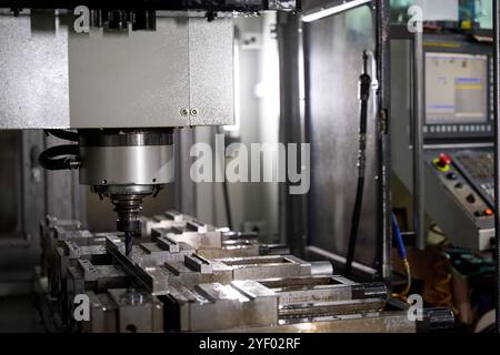Supervisor posing with arms crossed in metalworking factory Stock Photo