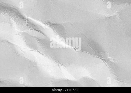 Crumpled wrinkled white wrapping paper as abstract empty background for design Stock Photo