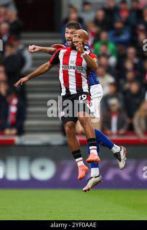 London, UK. 26th Oct, 2024. Ipswich Town defender Cameron Burgess (15) challenges Brentford FC midfielder Bryan Mbeumo (19) during the Brentford FC v Ipswich Town FC English Premier League match at the Gtech Community Stadium, London, England, United Kingdom on 26 October 2024 Credit: Every Second Media/Alamy Live News Stock Photo