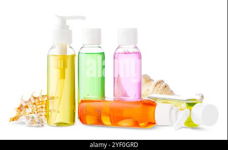 Assorted skincare products displayed on a white surface with a seashell Stock Photo