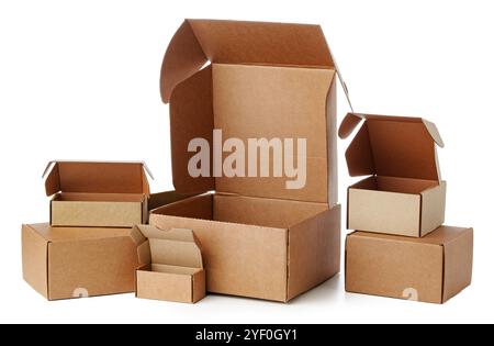 Stacked brown cardboard boxes in various sizes arranged on a white background Stock Photo