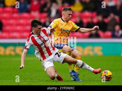 Stoke City's Andy Moran (left) and Sunderland's Dennis Cirkin battle ...