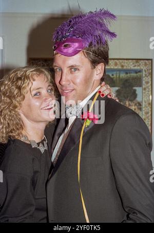 Snapshot of festive New Year's Eve party 1988 with attractive couple in formal attire, New York City, United States Stock Photo