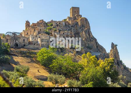 A picturesque view of the abandoned, old mountain town of Craco, built of sandstone rock. Craco is a ghost town abandoned due to an earthquake in the Stock Photo