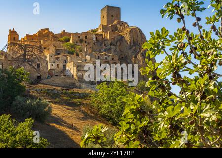 A picturesque view of the abandoned, old mountain town of Craco, built of sandstone rock. Craco is a ghost town abandoned due to an earthquake in the Stock Photo