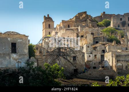 A picturesque view of the abandoned, old mountain town of Craco, built of sandstone rock. Craco is a ghost town abandoned due to an earthquake in the Stock Photo