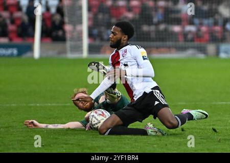 James Brophy ( 7 Cambridge United) challenged by Hector Kyprianou (22 ...