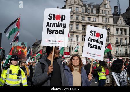 On November 2nd 2024 thousands of people met in Whitehall to march to the American Embassy in support of Palestine, demanding a ceasefire and the end Stock Photo