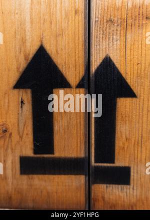 This end up fragile sign with up arrows on a wood box Stock Photo