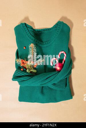 Turquoise green retro sweater wool background and Christmas decorations top view Stock Photo