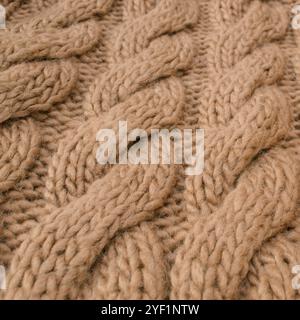 Winter wool hand-knit beige sweater. Clothes textile background Stock Photo