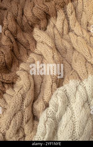 Winter woolen knitting beige sweater clothing. Textile background Stock Photo