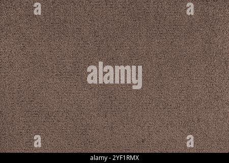 Plain brown colored microfiber detail texture. Structure of suede leather upholstery closeup, macro. Wallpaper, backdrop, textile background. Stock Photo