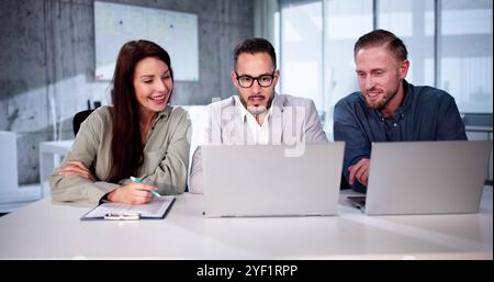Busy Business People With Laptop. Meet Colleagues In Office Stock Photo