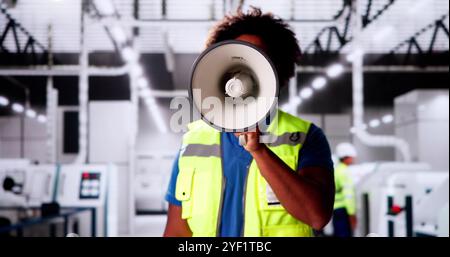 African Speaker Announce News In Megaphone. Excited Man Shouting Stock Photo