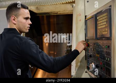 Engineers holding clipboard discussing in metallurgy factory Stock Photo