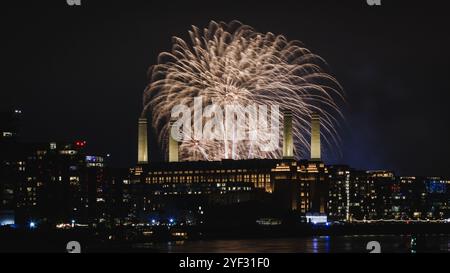 Fireworks illuminate the night sky over Battersea Power Station. Stock Photo