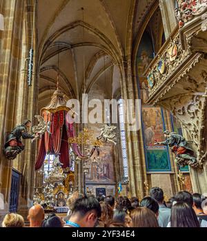 St Vitus Cathedral's Gothic Interior With St John of Nepomuk Silver Tomb and Angel Canopy in Prague Castle in Prague, Czech Republic. Stock Photo