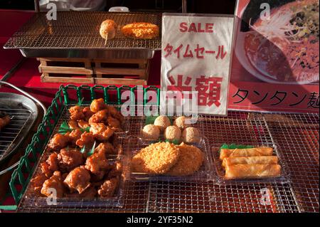 Street vendor displaying Chinese snacks in the Chinatown district called 'Nankin-machi' in Kobe City, Hyogo, Japan. Stock Photo