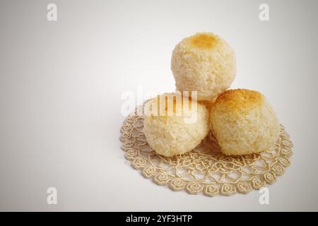 Three Toasted Coconut Macaroons on a Doily Stock Photo