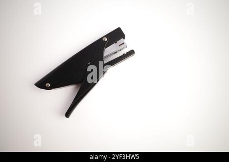 Isolated Black Handheld Stapler on White Background Stock Photo