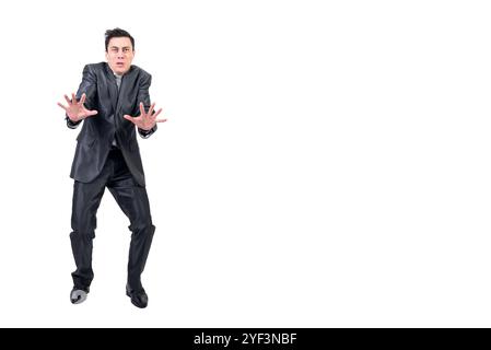 Frighted man in elegant suit. White background. Stock Photo