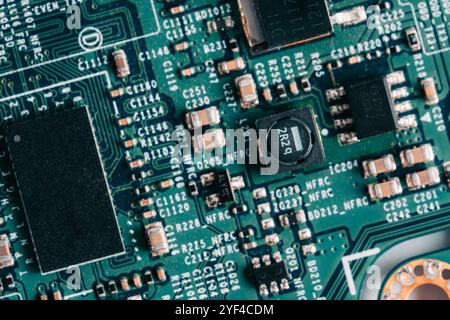 Electronic circuit board closeup. Electronic hardware technology. Motherboard digital chip. Tech science background Stock Photo
