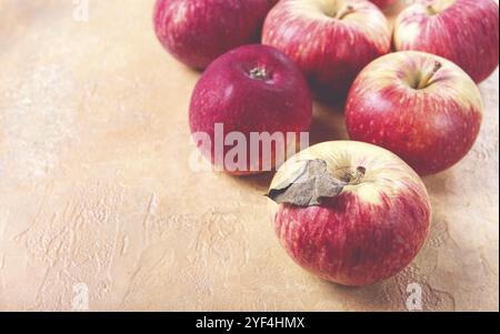 Apples scattered on the table, selective focus, yellow, red, summer variety, early, no people Stock Photo