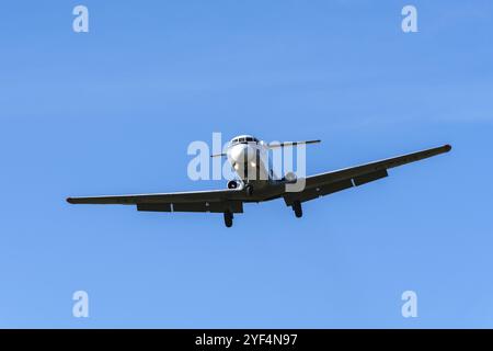 Russian regional jet Yakovlev Yak-40K, three-engined jet airliner, passenger commuter trijet in flight against blue sky in cloudless weather. Tail num Stock Photo