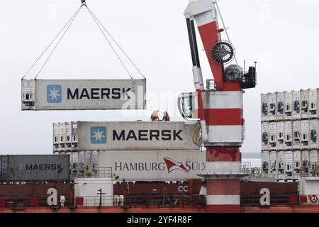 Crane unloads container ship Sevmorput, Russian nuclear-powered icebreaker lighter aboard ship carrier. Container terminal seaport. Pacific Ocean, Kam Stock Photo