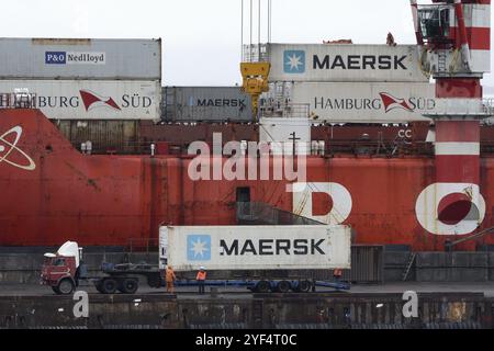 Crane unloaded container cargo ship Sevmorput, nuclear-powered icebreaker lighter aboard ship carrier. Terminal commercial seaport. Pacific Ocean, Kam Stock Photo