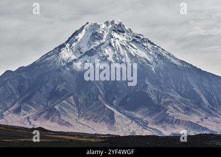 Beautiful autumn volcanic landscape, view of snow-capped cone of stratovolcano Bolshaya Udina Volcano in Klyuchevskaya Group of Volcanoes. Russian Far Stock Photo