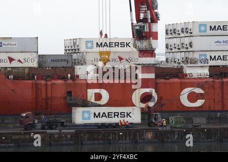 Crane unloads container ship Sevmorput, Russian nuclear-powered icebreaker lighter aboard ship carrier. Terminal commercial sea port. Pacific Ocean, K Stock Photo