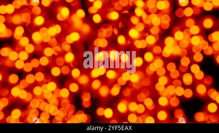 Defocused cityscape lights creating a beautiful bokeh effect against a dark night background. Multicolored hexagonal and circular light spots Stock Photo