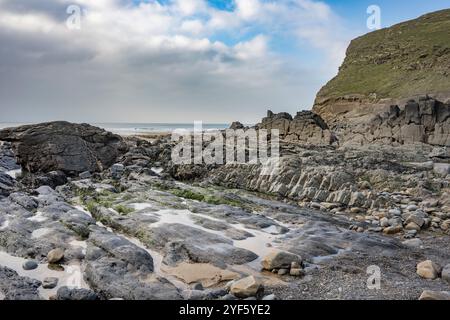 Rain clouds disperse over Duckpool in Cornwall Stock Photo