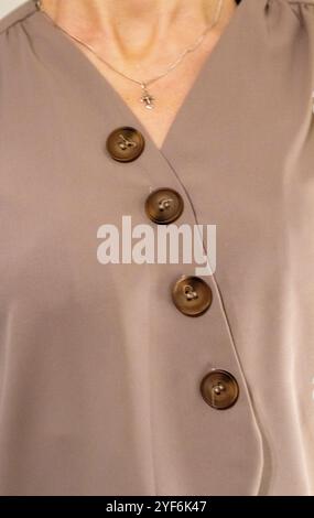 Skinny woman wearing stylish warm tone blouse Stock Photo