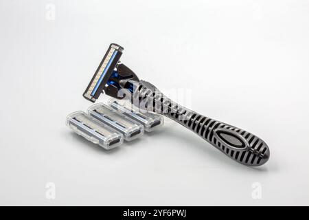 Studio shoot shaving razors machine with replaceable cassette blades closeup on white. Stock Photo