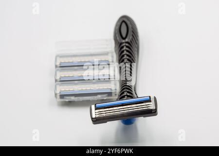 Studio shoot shaving razors machine with replaceable cassette blades closeup on white. Stock Photo