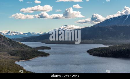 Aerial view in Canada during summer time with mountains, lakes and scenic area in panoramic view. Taken in Yukon Territory near Otter Falls. Stock Photo