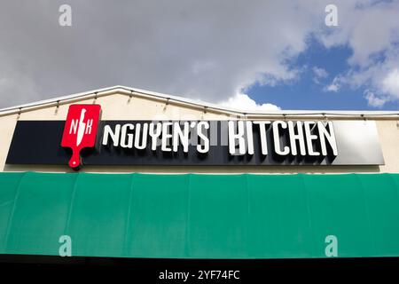 Orange, California, United States - 03-10-2019: A view of a store front sign for the pan Asian restaurant known as Nguyen's Kitchen. Stock Photo