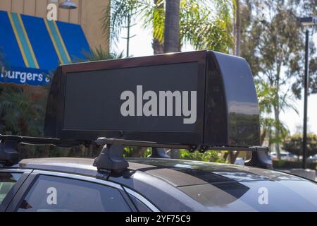 Los Angeles, California, United States - 03-12-2019: A view of a blank vehicle LED roof sign on top of a car. Stock Photo