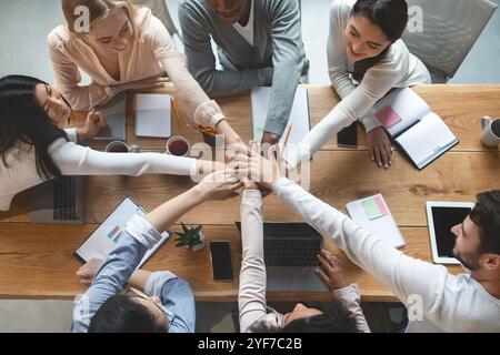 People putting hands together for united, cooperation and teamwork concept Stock Photo