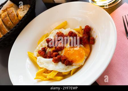 Fried eggs with chistorra Stock Photo